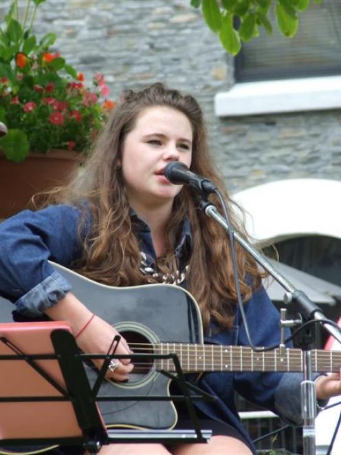 Arrowtown's Ruby Bain entertains crowds on the Village Green yesterday, part of the 2012-13...