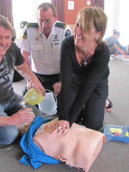 Arrowtown volunteer firefighters Glenn Parnell (left) and Deborah Love (right) are taught life...