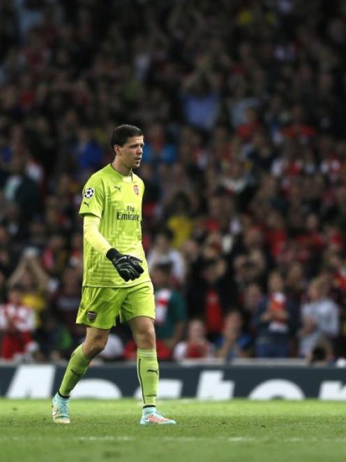 Arsenal goalkeeper Wojciech Szczesny leaves the pitch after being shown a red card by match...