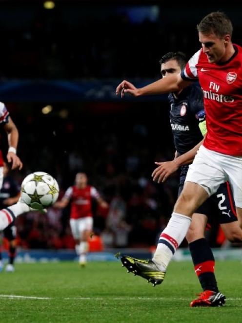 Arsenal's Aaron Ramsey scores a goal against Olympiakos Piraeus during their Champions League...