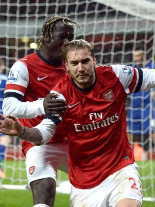Arsenal's Nicklas Bendtner (R) celebrates his goal against Cardiff City with Bacary Sagna....