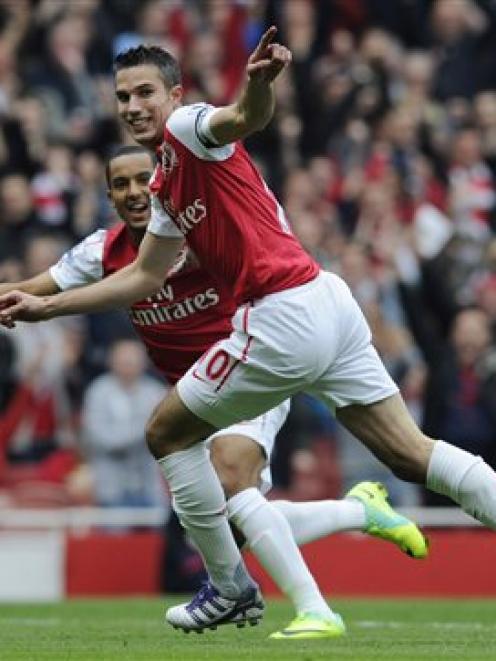 Arsenal's Robin van Persie, right, celebrates with Theo Walcott after scoring against Sunderland...