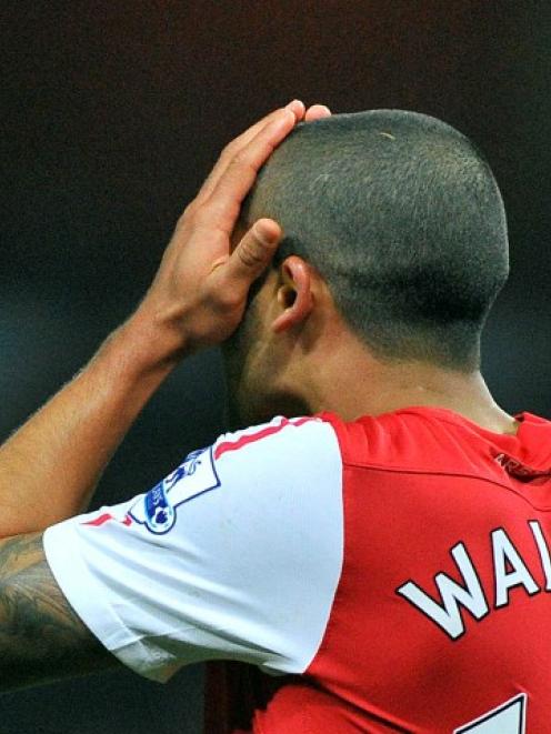 Arsenal's Theo Walcott reacts after missing a goal-scoring opportunity against Newcastle United...