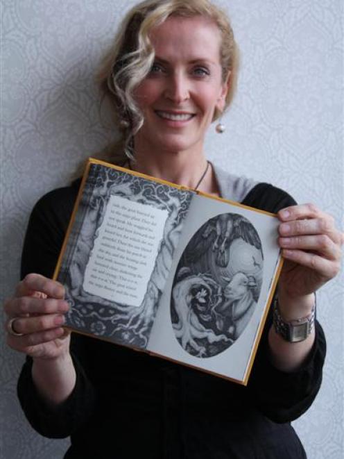 Artist Deidre Copeland with the newly-published Janet Frame novella, The Mijo Tree.