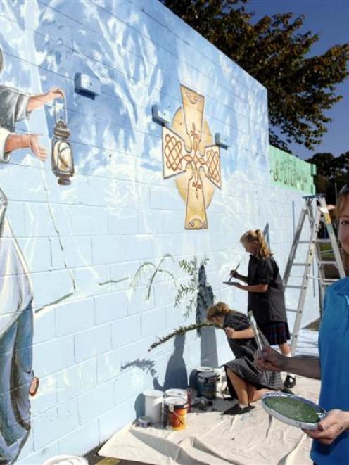 Artist Eleanor Yates creates a larger than life mural of Nano Nagle at St Peter Chanel School in...