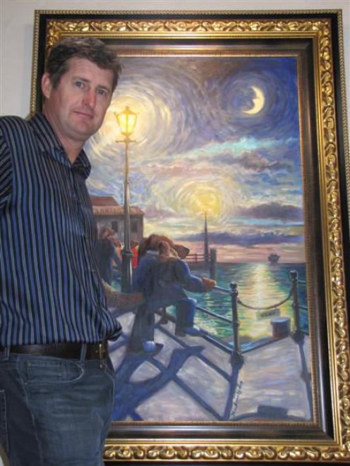 Artist Ivan Clarke stands proudly in front of his original painting of the Lonely Dog, which...