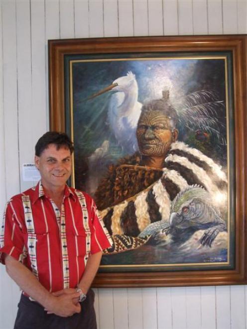 Artist Peter Jean Caley stands beside one of his paintings on display in Waimate this month....