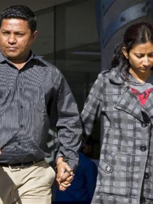 Ashish Macwan leaves the Manukau District Court yesterday, with wife Kinnary, after pleading...