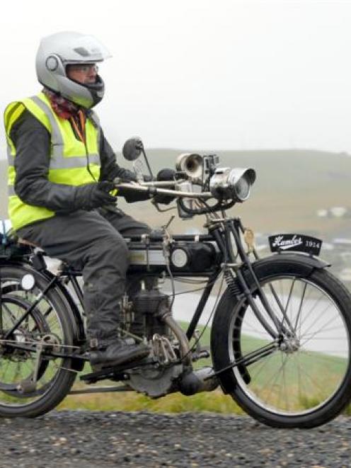 Ashley Blair rides his 1914 Humber motorcycle on Lammerlaw Rd, Waipori, yesterday. Photo by...