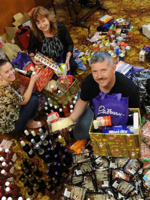 Assembling Christmas hampers for redundant Hillside workers are (from left) Simone Hourigan,...