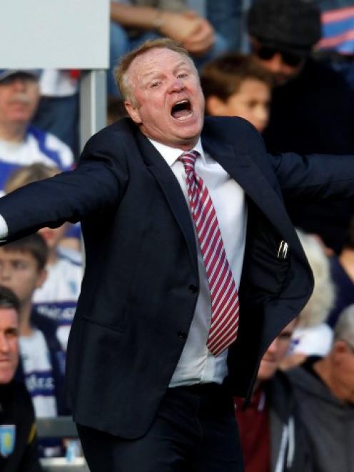 Aston Villa manager Alex McLeish reacts during his team's Premier League match against Queens...