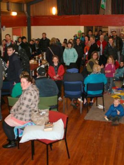 At least 220 people cram into the Waitati Hall, north of Dunedin, last night after motorists...