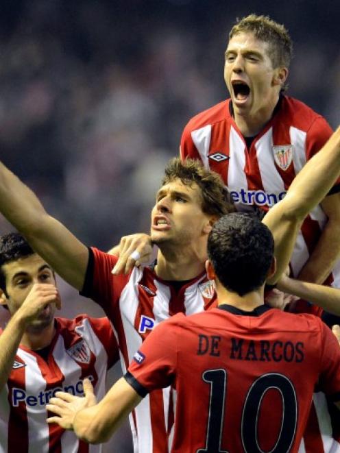 Athletic Bilbao's Fernando Llorente (C) celebrates scoring against Manchester United during their...