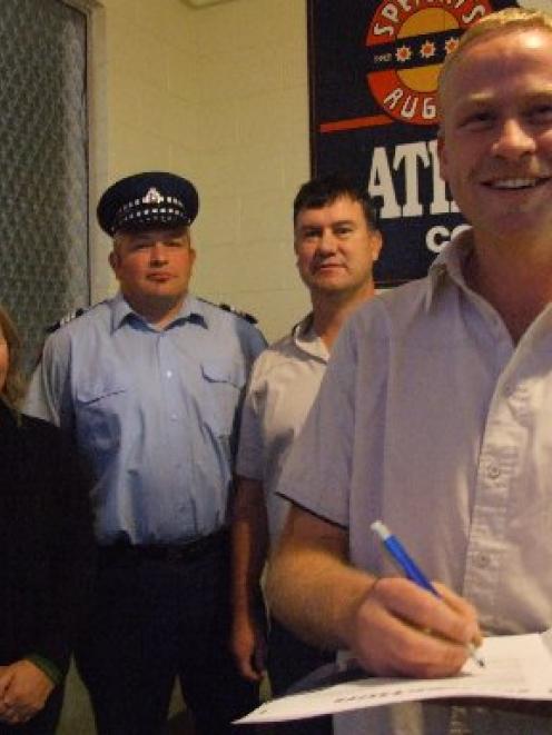 Athletic Marist Rugby Football Club premier player Jon Sinclair signs an alcohol-related contract...