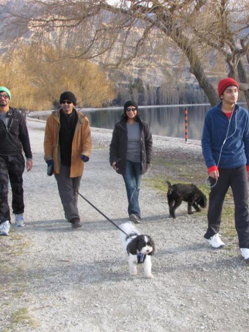 Auckland family (from left) Rehan (18), Channaka, Millie and Lasharn Weerasinghe (19), walk...