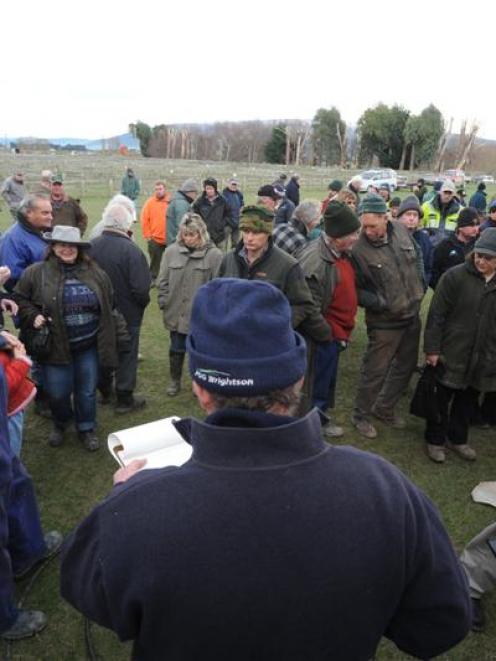 Auctioneer Jon Newman takes a bid yesterday. Photos by Stephen Jaquiery.