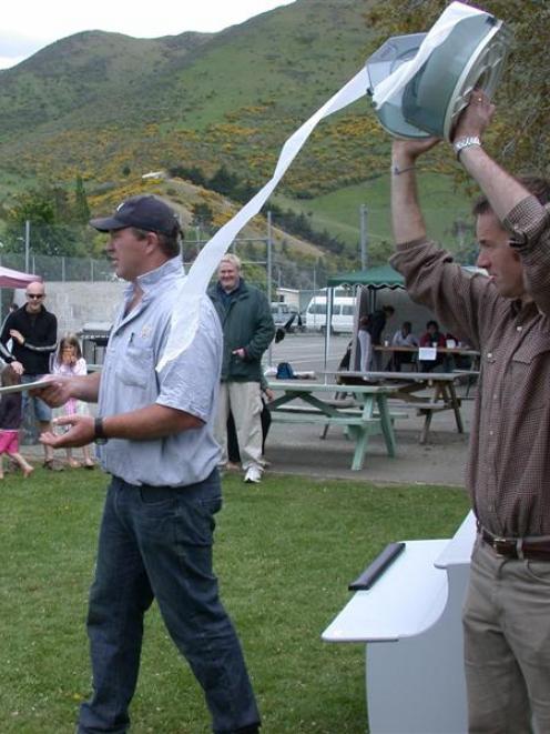 Auctioneer Reagan Laughton (left) and Michael Smith, both of Kurow, were even selling off toilet...