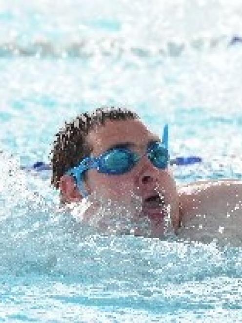 August Landrebe competes in the 50m freestyle. Photo by Craig Baxter.