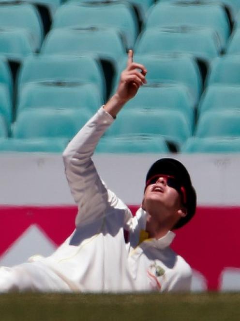 Australia captain Steven Smith reacts after dropping a catch from India's Lokesh Rahul during the...