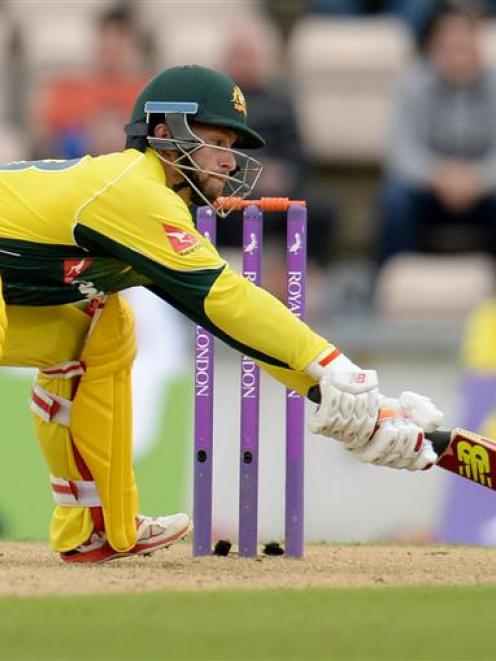 Australia's Matthew Wade reaches to play a shot on the offside. Photo: Reuters.