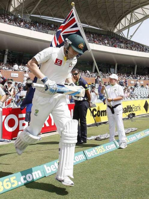 Australia's Michael Clarke runs onto the Adelaide cricket ground at the start of day two. REUTERS...