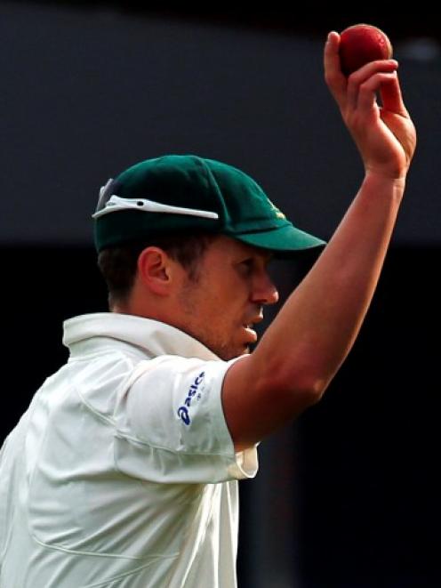 Australia's Peter Siddle acknowledges the crowd after taking five wickets during the third day's...