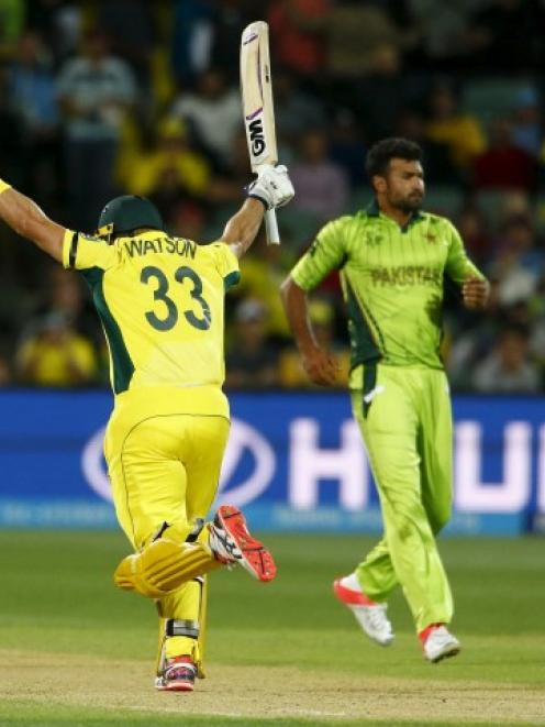 Australia's Shane Watson celebrates as he scores the winning run against Pakistan. REUTERS/David...