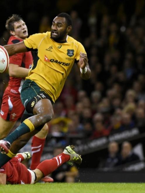 Australia's Tevita Kuidrani breaks through the Welsh defence on his way to the try line. REUTERS...