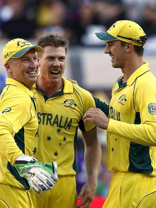Australia's wicketkeeper Brad Haddin (L) celebrates with team-mates James Faulkner (2nd L) and...
