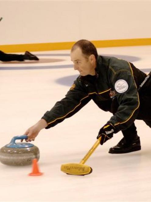 Australian curlers Laurie Weeden (left) and Ian Palangio practise at the Dunedin Ice Stadium this...