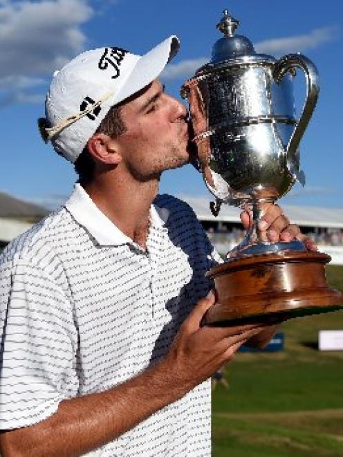 Jordan Zunic kisses the winner's trophy after his victory yesterday. Photo: Photosport