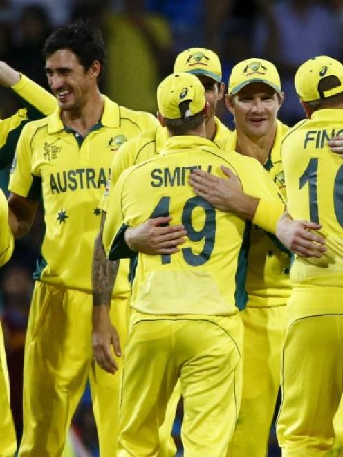 Australian players celebrate their win over India in Sydney. REUTERS/David Gray