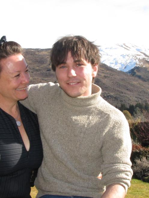 Australian tourist Cuoran O'Flynn shares a hug with his relieved aunt Annabel O'Flynn after being...