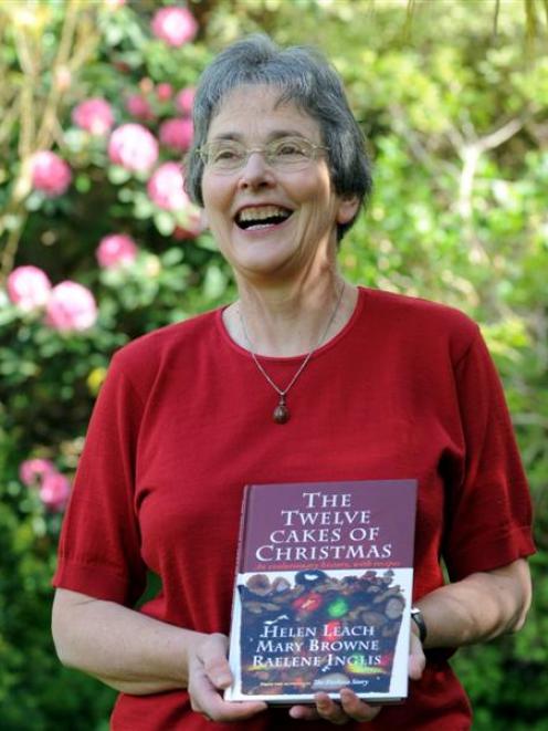Author Helen Leach with her Christmas cake book. Photo by Peter McIntosh.