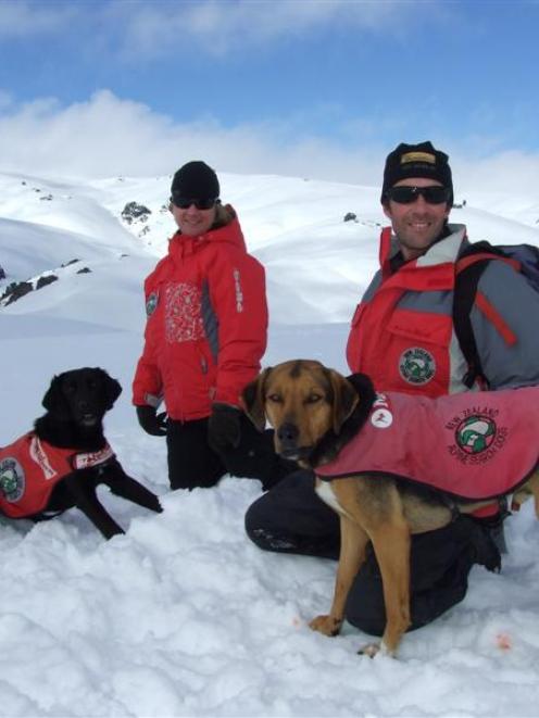 Avalanche search dog Tussock and handler Dave McKinley take a break from their national SAR...