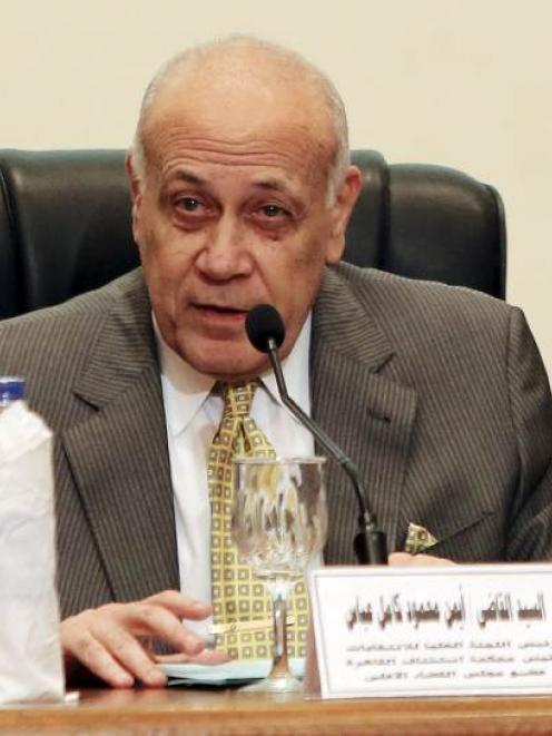 Ayman Abbas, head of the High Elections Committee, speaks during a news conference in Cairo,...
