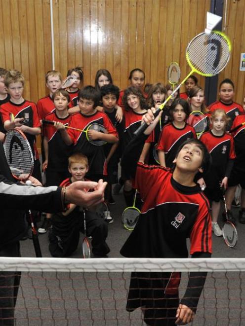 Badminton Otago development officer Jeff Elliotte helps Dunedin North Intermediate year 7 pupil...