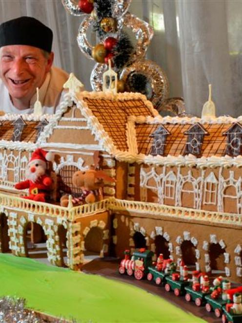 Baker Steve Mee with his gingerbread Dunedin Railway Station at the Scenic Southern Cross Hotel...