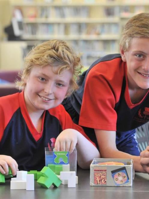 Balmacewen Intermediate pupils (from left) Sam Thompson and George Bates  use puzzles to develop...