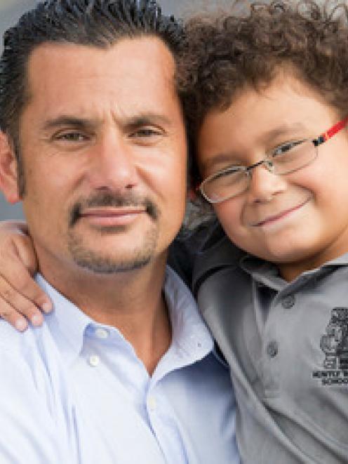 Banapa Avatea with his five-year-old son Jordan. Photo: NZ Herald