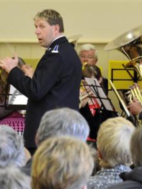 Band master Tony Hayward conducts the Salvation Army band at the Port Chalmers town hall...