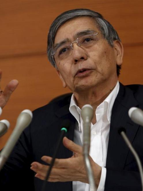 Bank of Japan governor Haruhiko Kuroda speaks during a news conference at the bank's headquarters...