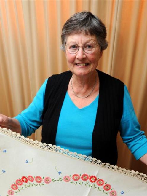 Barbara Rowe with  vintage linen she is selling to raise funds for a foodbank. Photo by Gregor...