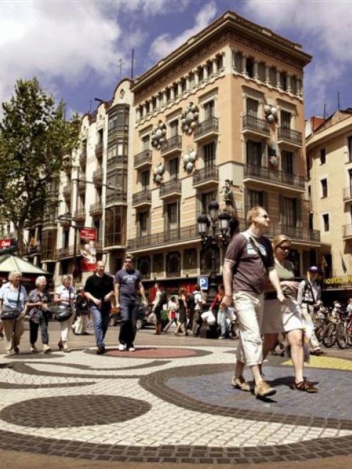 Barcelona's La Rambla is a social scene, informal stage and site of unusual stores. Photo by The...