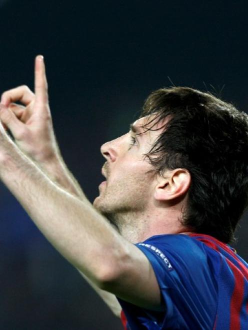 Barcelona's Lionel Messi celebrates scoring his second penalty against AC Milan during their...