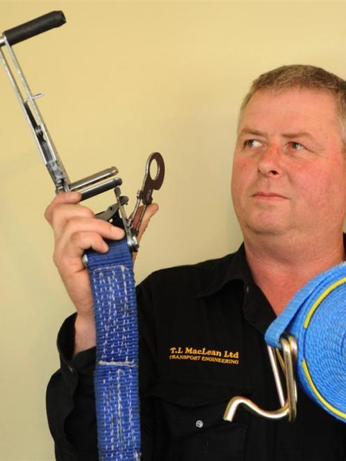 Barry Armour shows the side-loading ratchet which he has invented. Photo by Stephen Jaquiery.