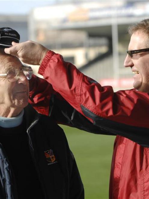 Barry Haig, the son of Jimmy Haig, puts an All Black Cap on his uncle, Bert Haig, the brother of...