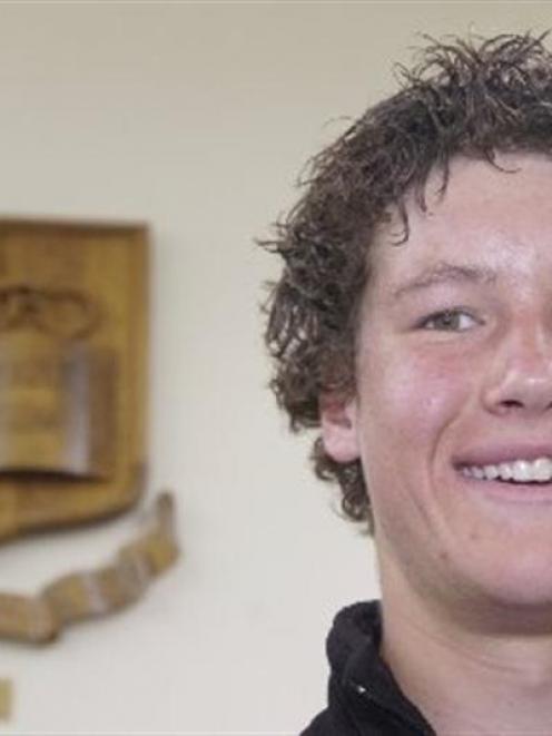 Bayfield High School head boy Jeff Notman (17), in front of the school's crest and motto. Photo...