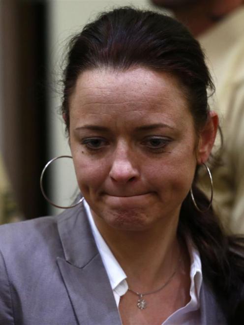 Beate Zschaepe arrives in the courtroom in Munich.       REUTERS/Kai Pfaffenbach