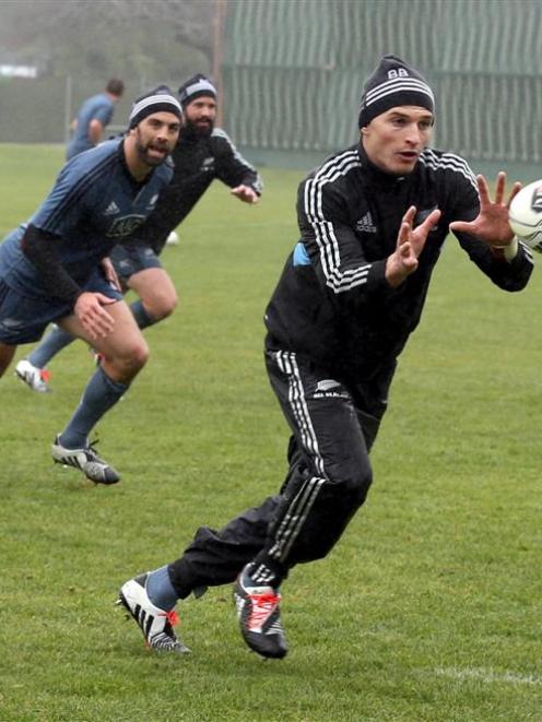 Beauden Barrett is backed up by Conrad Smith and Ryan Crotty during All Black training at the...
